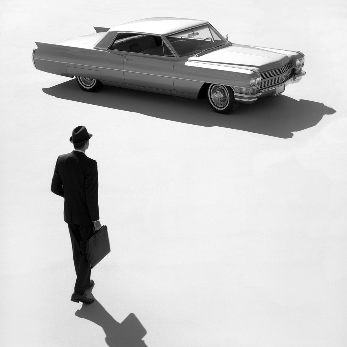 A Business Man Approaching His 1950s Cadillac de Ville