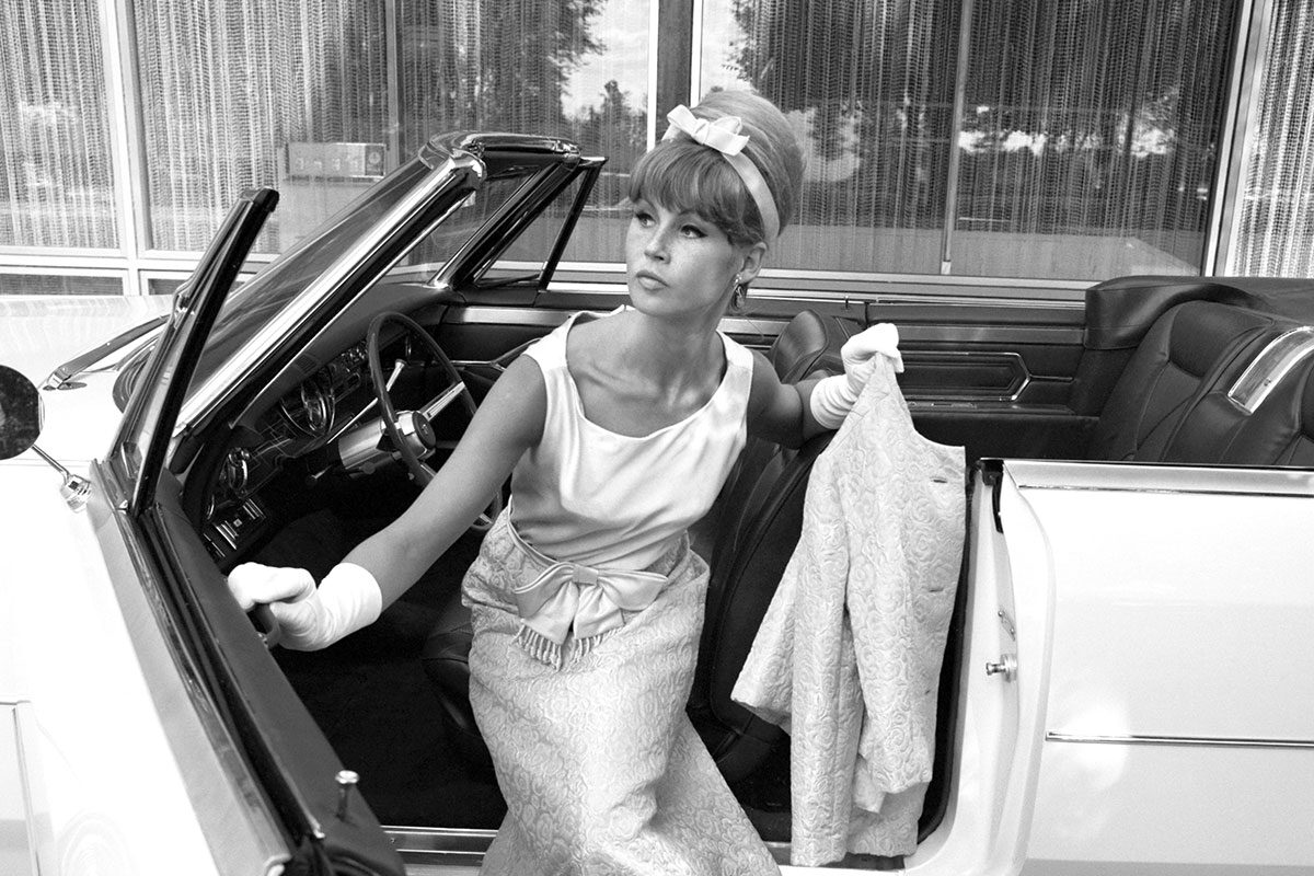 Woman In Dress Getting Out Of Her Cadillac Classic Coupe