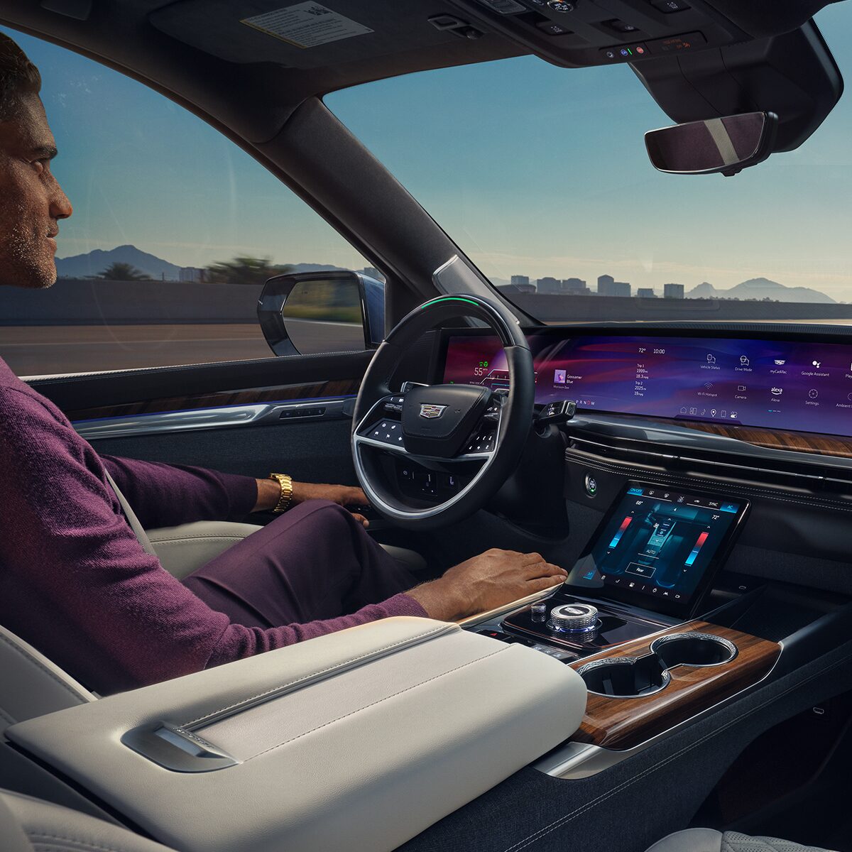 A Man Driving the Cadillac Escalade  Utilizing the Hands-free Super Cruise Feature