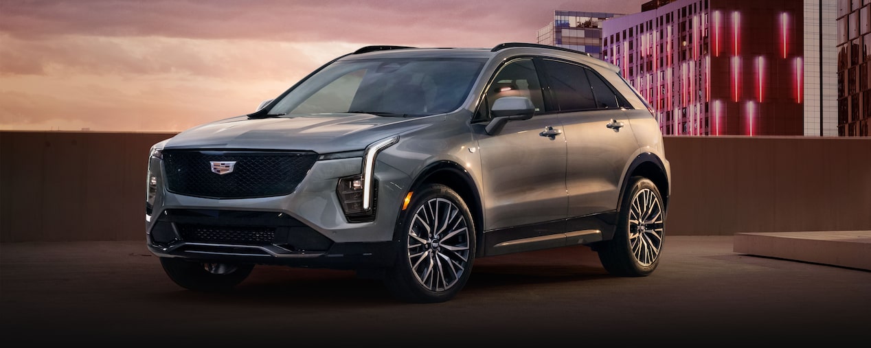 Front Side View of the 2025 Cadillac XT4 Parked on Top Parking Garage Level in the City