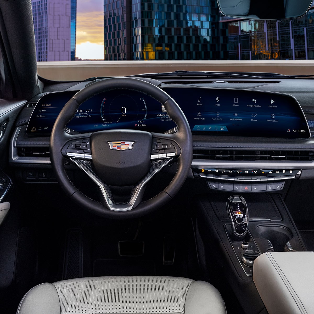 Driver's Seat View of the 2025 Cadillac XT4 Sleek Dashboard Outlooking the City