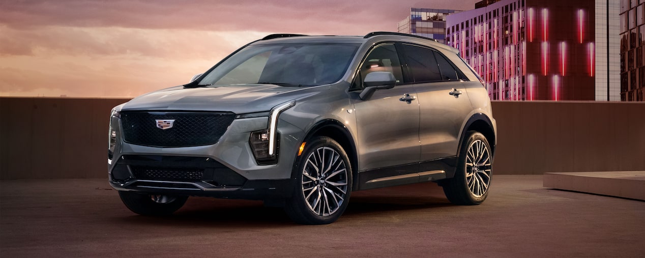 Front Side View of the 2025 Cadillac XT4 Parked on Top Parking Garage Level in the City