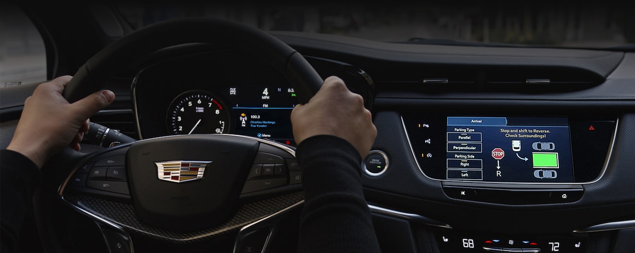 A Man Uses the Automatic Parking Assist Technology of the 2025 Cadillac XT5