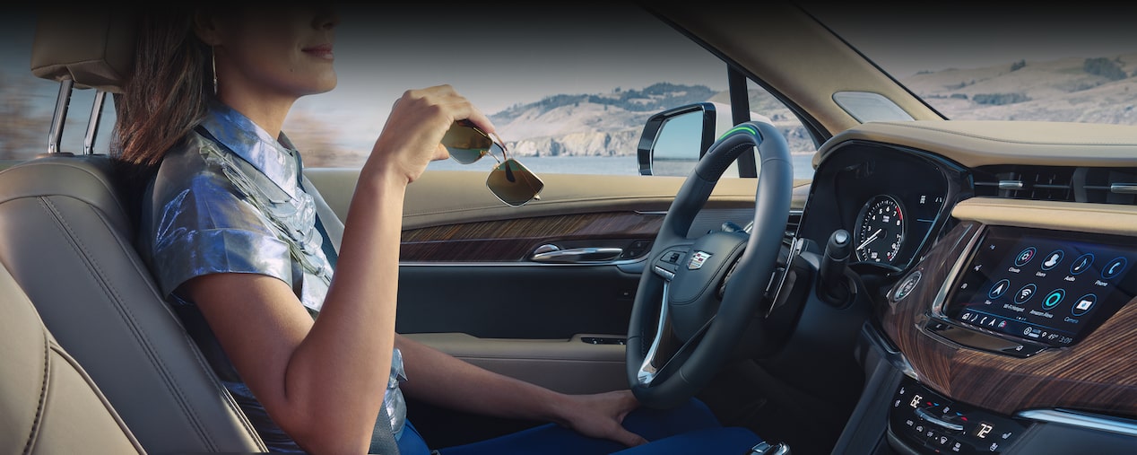 Driver's Perspective Shot of the Steering Wheel and Dashboard of a Cadillac XT6