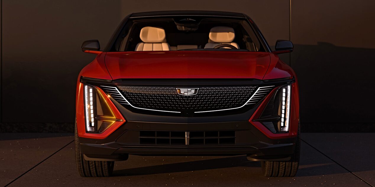Front View of a Parked Red 2025 Cadillac LYRIQ and Close-up on LED Slim Headlights