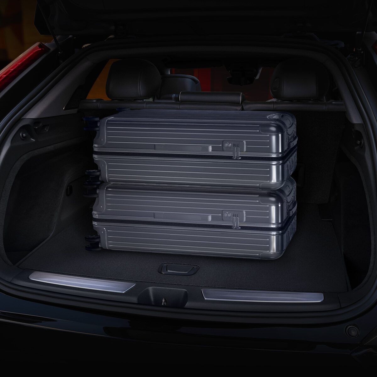 Close-up View of Luggage Stacked in the 2025 Cadillac OPTIQ Cargo Space