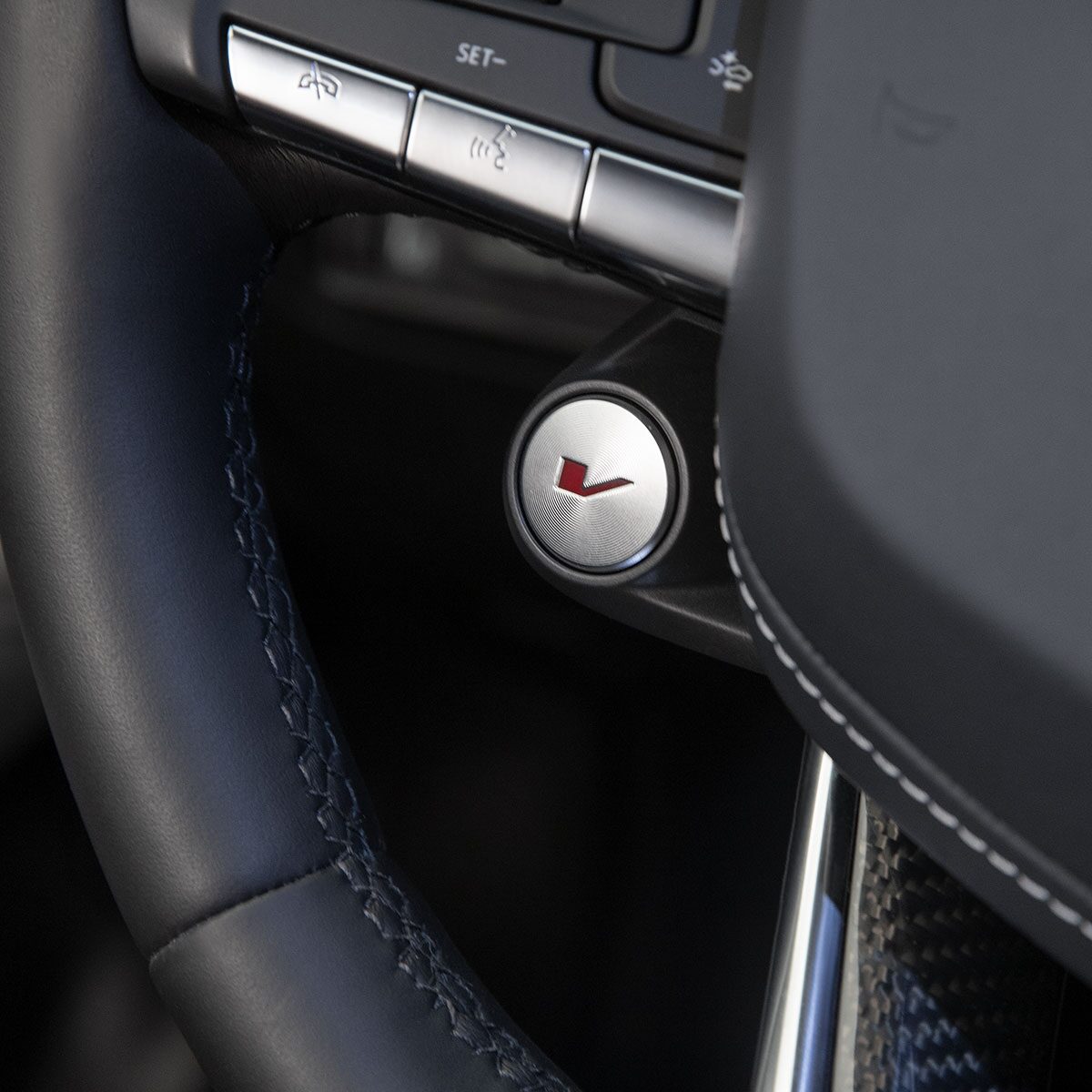 Close-up of the V Button on the 2025 CT4-V Steering Wheel