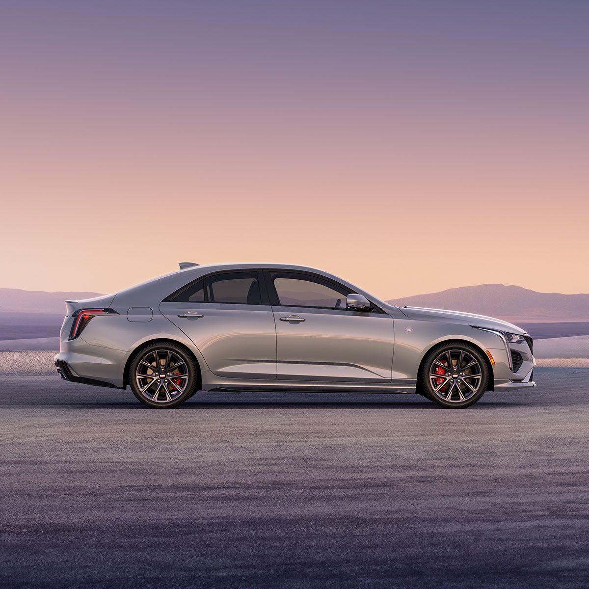 Side Profile View of a Silver 2026 CT4 Parked in the Open Desert