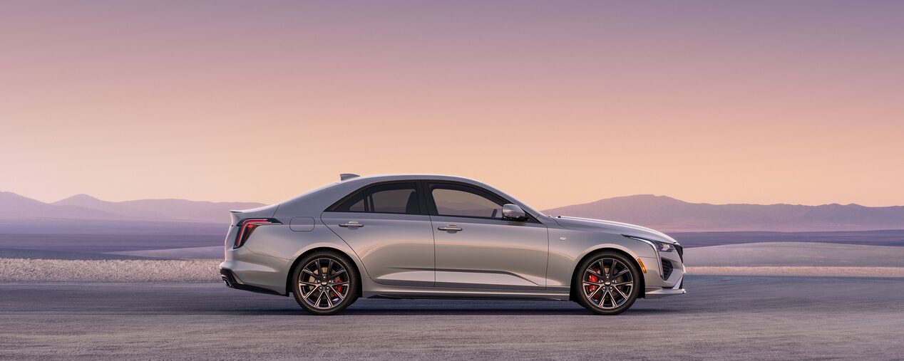Side Profile View of a Silver 2025 CT4 Parked in the Open Desert