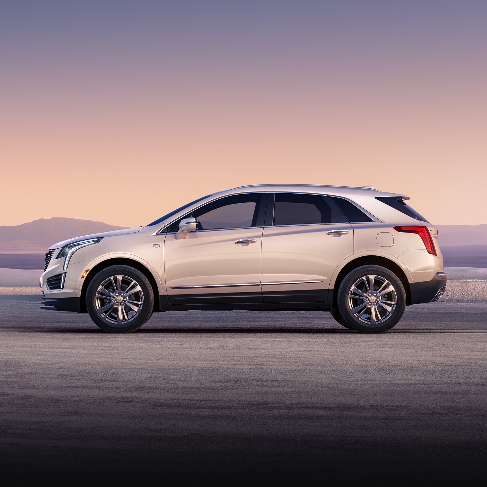 The Crystal White Tricoat Cadillac XT5 Parked During a Lovely Sunset