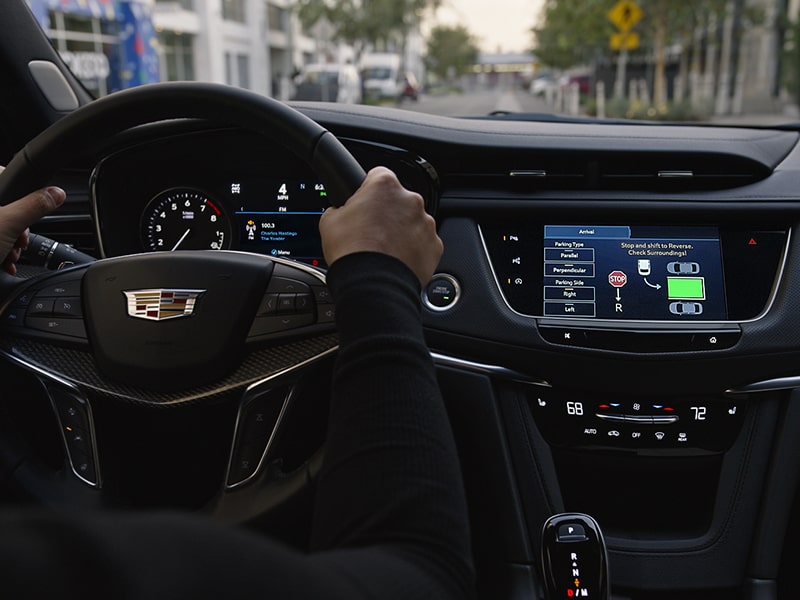 ﻿ A Man Uses the Automatic Parking Assist Technology of the 2026 Cadillac XT5