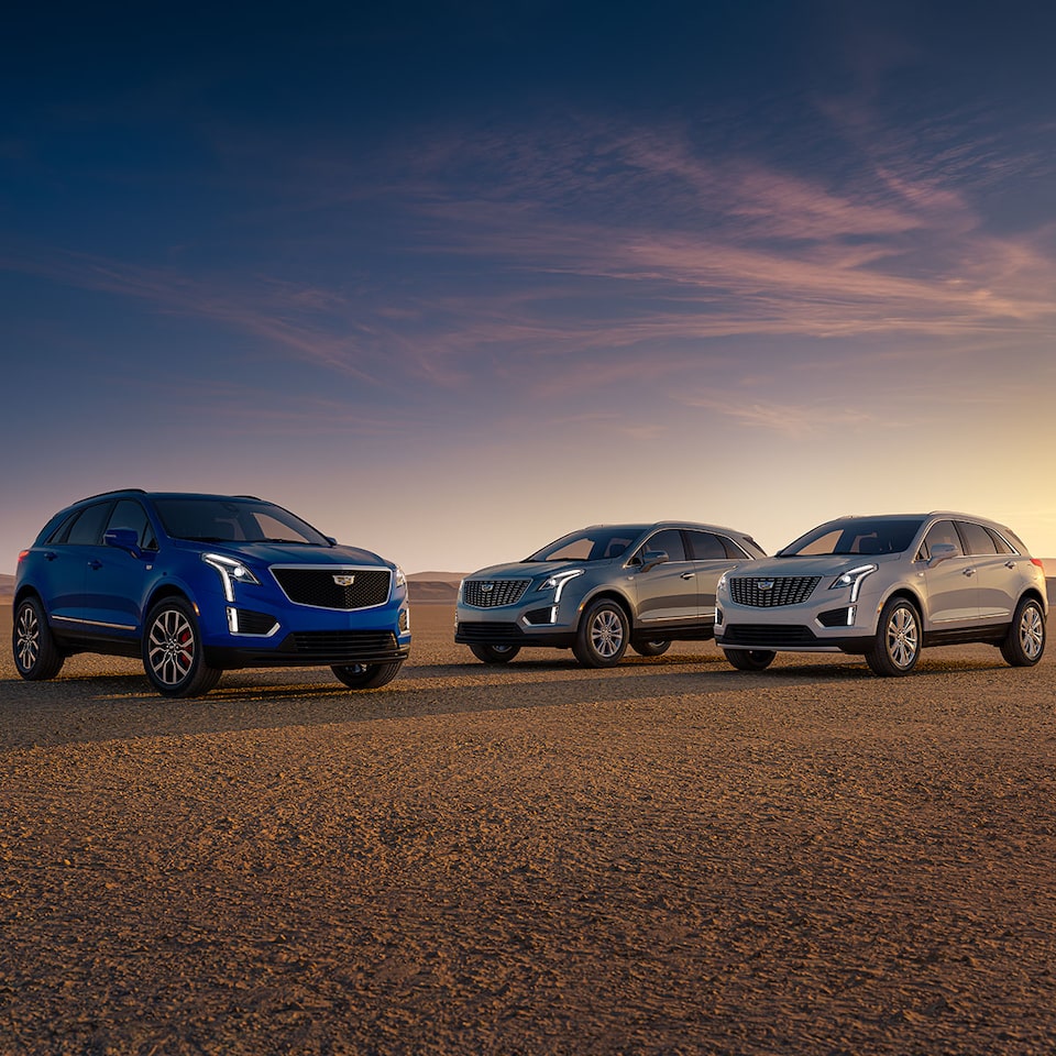 The Dark Moon Blue Metallic Cadillac XT5 Parked During the Sunset in Desert