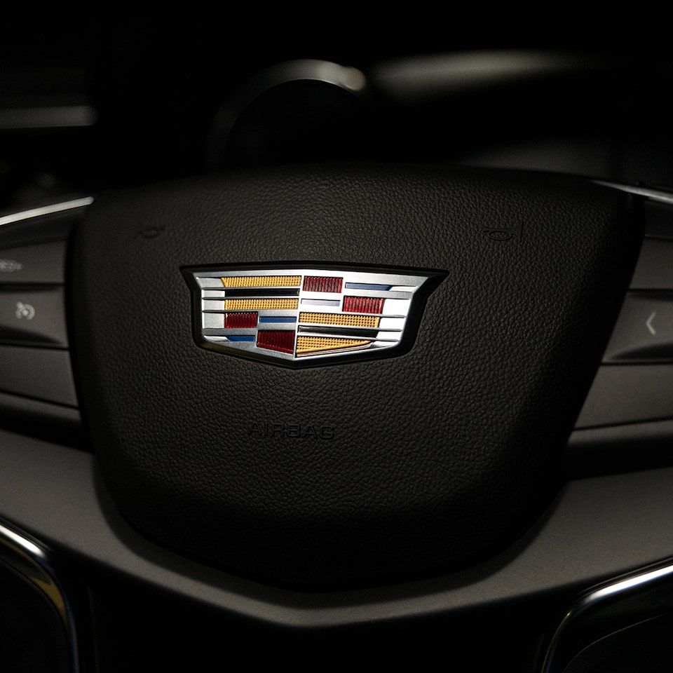 Close up of the Cadillac Logo on the 2026 XT5 Steering Wheel