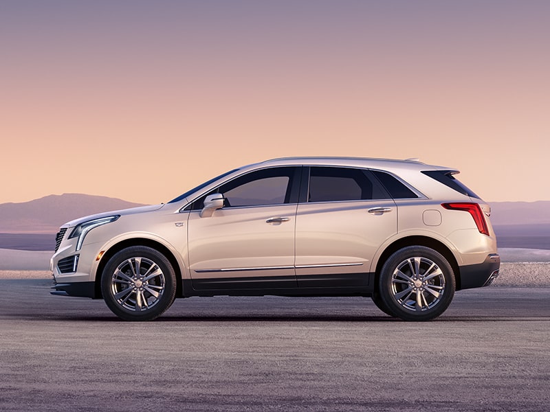 Profile Driver Side View of a White 2026 Cadillac XT5 Parked in the Desert