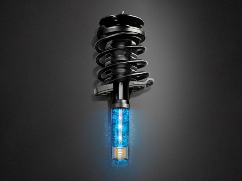 The 2025 Cadillac Escalade Suspension Part on Gray Background