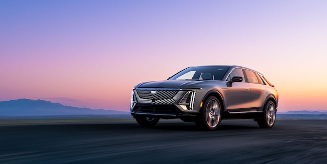 Front view of the Cadillac LYRIQ driving on the road.