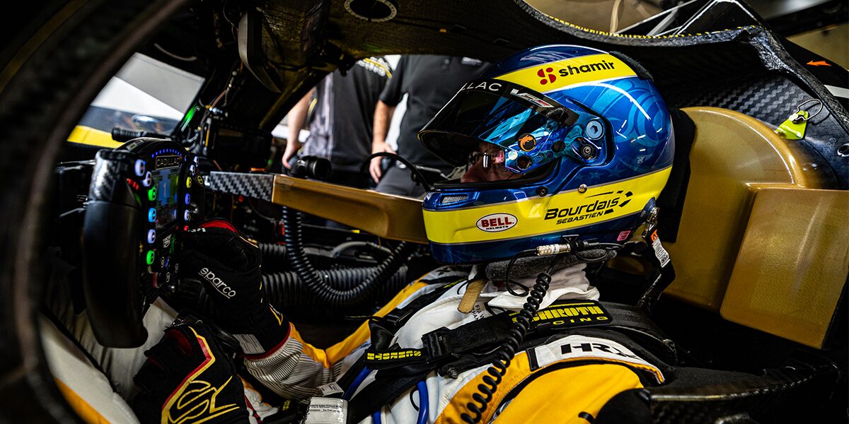 Close-up of a Cadillac Racecar Driver in the Front Seat