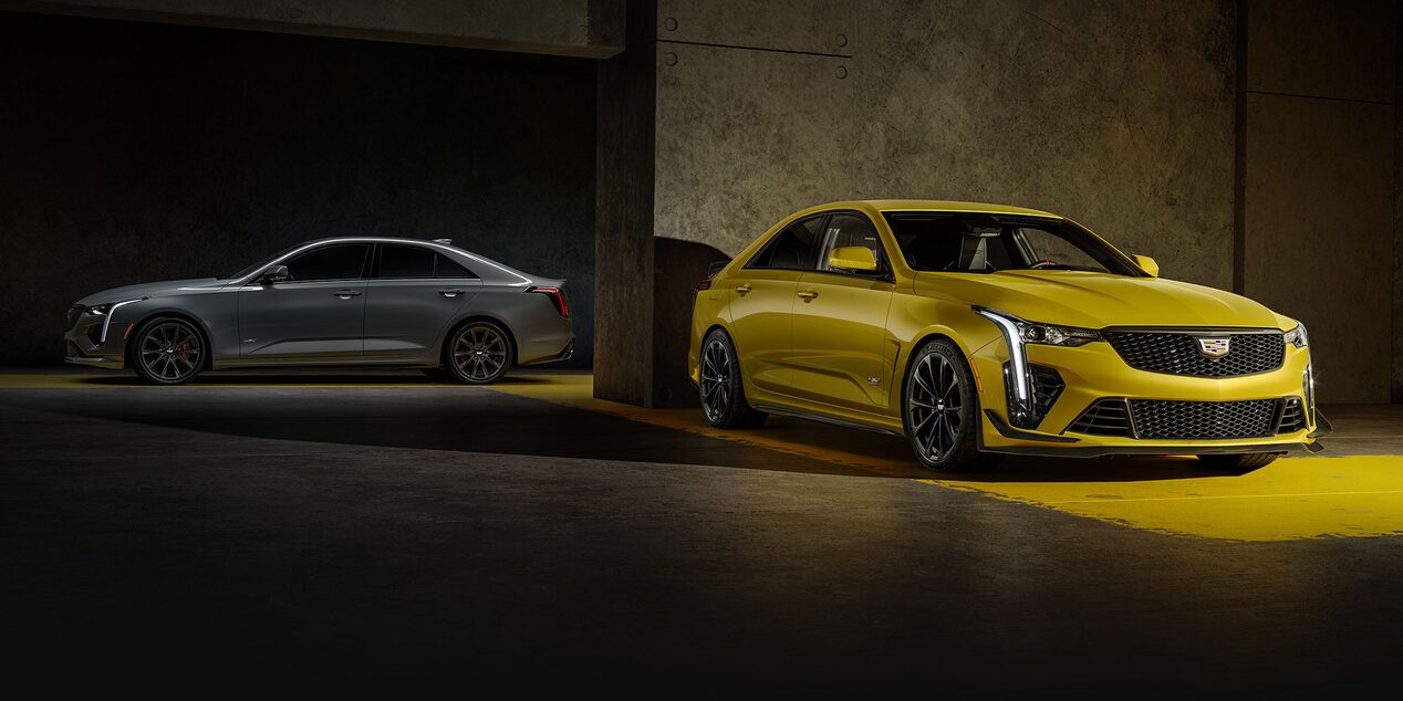 A 2025 Red Cadillac Escalade-V Parked in Front of a Modern Home